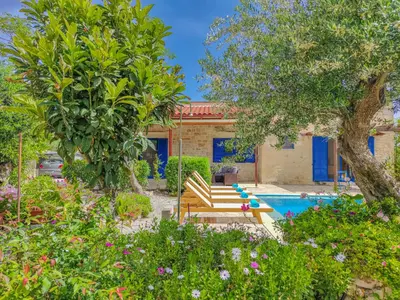 a pool with a bench and trees and a house at Lemon Tree Villa with Private Pool and Starlink Internet in Frés