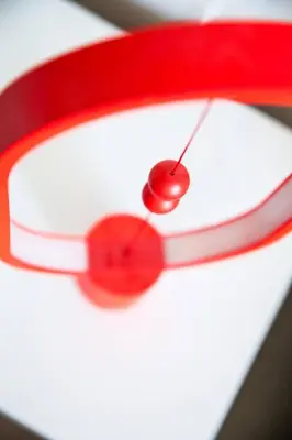 a red ribbon with a red dot on it at Secret Loft, 2min Walk From The Beach, High Tech in Chania Town