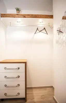 a closet with a dresser in a room at Secret Loft, 2min Walk From The Beach, High Tech in Chania Town