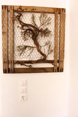 a painting of a tree on a wall at Phaedra House For Relaxing Holidays Near Platanias in Vlakheronítissa
