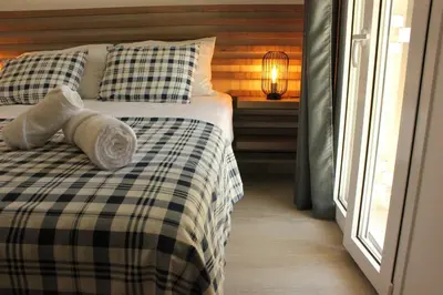 a bedroom with a bed with pillows and a window at Phaedra House For Relaxing Holidays Near Platanias in Vlakheronítissa