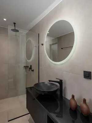 a bathroom with a sink and a mirror at Theta Boutique Hotel in Chania Town