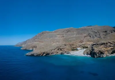 an aerial view of a small island in the ocean at Ilingas Hotel in Khóra Sfakíon