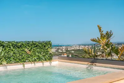 a swimming pool with a view of a city at Disegno Villa - Rooftop Pool in Kolymvari