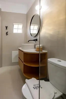 a bathroom with a sink and a mirror and a toilet at Ros Solis Luxure House in Chania Town