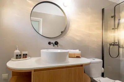 a bathroom with a sink and a mirror at Ros Solis Luxure House in Chania Town