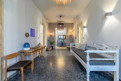 a room with two bunk beds and a table at Casa di Batsi in Chania Town