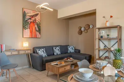 a living room with a couch and a table at Armeria Apartments in Daratso