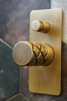 a wooden door handle on a wooden door with a knob at L A Boutique Suites with Private Hot Tub in Kalathas