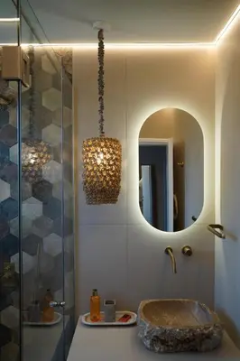 a bathroom with a sink and a mirror at L A Boutique Suites with Private Hot Tub in Kalathas
