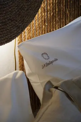 a white pillow with the word lebanon on it at L A Boutique Suites with Private Hot Tub in Kalathas