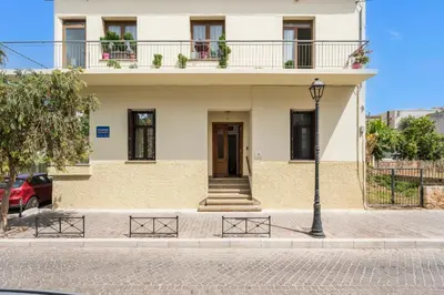 a building on a street with a light pole at Tatianas Kanevaro in Chania Town