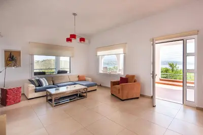 a living room with a couch and a table at Villa Kiara in Tersanas