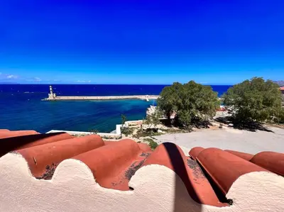 a view of the ocean from the roof of a building at Talos Too, Venetian Residence in Chania Town