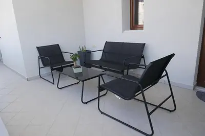 three black chairs and a table in a room at Giovanni City House near Chania City Center in Chania Town