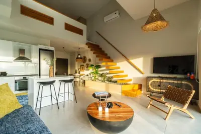 a living room with a couch and a table at Jarko Luxury Houses in Argoulidhés