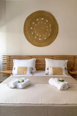 a bedroom with two towels on a bed at Four Seasons in Chania Town