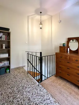 a room with a dresser and a clock on the wall at KOSTAS HOUSE in Chania Town