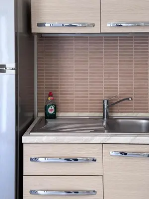 a kitchen with a sink and a counter top at KOSTAS HOUSE in Chania Town