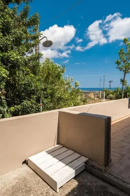 a bench sitting on the side of a wall at Serenitas, family house with great views in Sfakiá