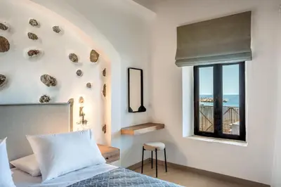 a bedroom with a bed and a window at Superb apartmentS Kriaras sea view in Sfakia in Khóra Sfakíon