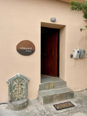 a entrance to a building with a red door at almond home in Livadia