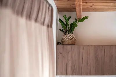 a plant sitting on a shelf in a bedroom at Lavender suite sea view in Plataniás