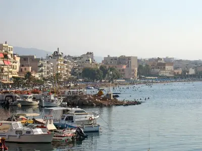a group of boats are docked in a harbor at Anna Kavros luxury apartment in Chania Town