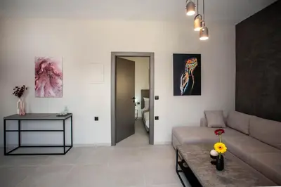 a living room with a couch and a table at Makel Apartment in Chania Town