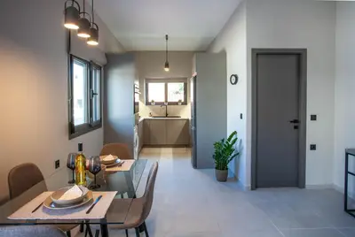 a dining room with a table and chairs at Makel Apartment in Chania Town