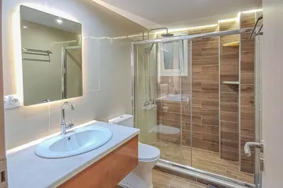 a bathroom with a toilet and a sink and a shower at Renovated apartment 3- Platanias in Plataniás