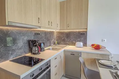 a kitchen with a sink and a counter top at Renovated apartment 2 -Platanias in Plataniás