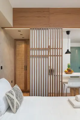 a bedroom with a white bed and a table at Nomas lifestyle living in Chania Town