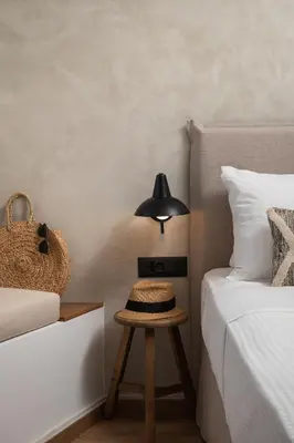 a bedroom with two beds and a table with a lamp at Nomas lifestyle living in Chania Town