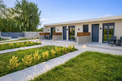 a house with a garden in front of it at Sweven boutique apartments in Souda