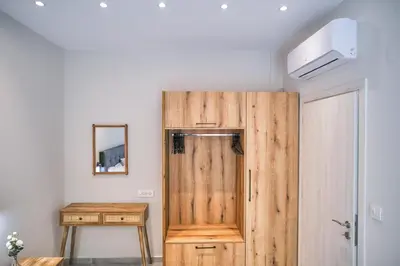 a wooden door in a room with a table at Sweven boutique apartments in Souda