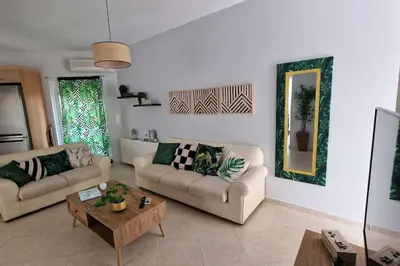 a living room with two couches and a table at E&G Relax Homes-C in Kissamos