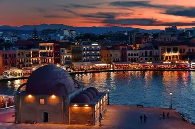 a view of a city at night with a body of water at E&G Relax Homes-C in Kissamos