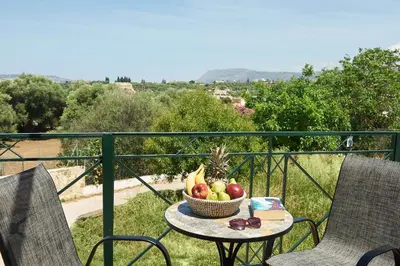 a basket of fruit on a table on a balcony at serenissimo A&A in Galatás