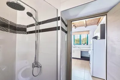 a bathroom with a shower and a sink at serenissimo A&A in Galatás