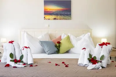 a bed with christmas decorations on top of it at Christini Cozy Apartment in Souda