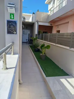 a walkway in a building with a sign on it at Angel's Nest in Chania Town