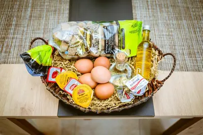 a basket filled with eggs and a bottle of beer at Nikola's Vineyard in Ayiá
