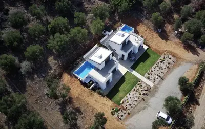 an aerial view of a house with a swimming pool at Isabel Artemis Crete - Luxury Sea Views Villas in Nopíyia
