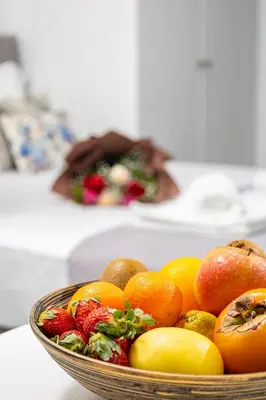 a bowl of fruit sitting on a table at Koum Kapi Mare Studios B2 in Chania Town
