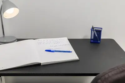 a notebook with a pen on a table with ainylinylinylinylinylinyl at Koum Kapi Mare Studios B2 in Chania Town