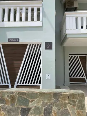 a pair of garage doors on a building at Koum Kapi Mare Studios B2 in Chania Town