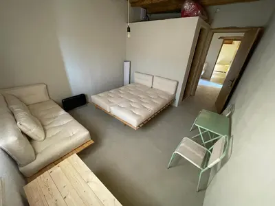 an overhead view of a living room with a couch and a chair at Petres old village house in Áyios Ioánnis