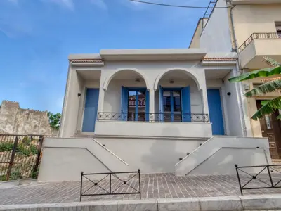 a house with a staircase in front of it at Il Porto Blu in Chania Town