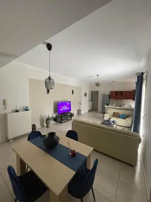 a living room with a couch and a table at Tzitzifianaki apartment in Chania Town